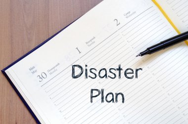 Afet planı yazın defter üzerinde