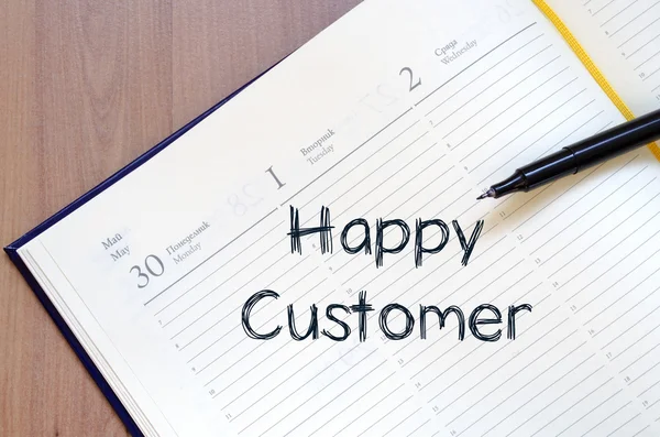 Happy customer write on notebook — Stock Photo, Image