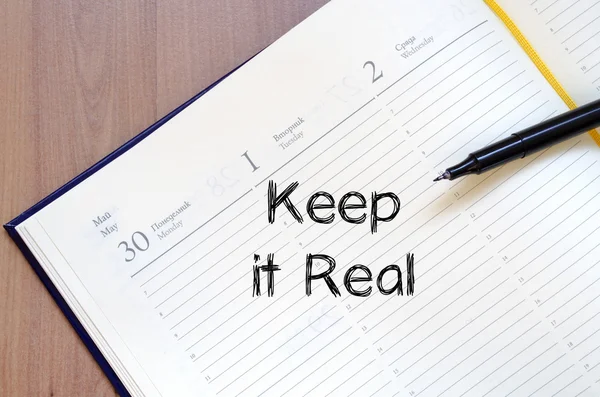 Keep it real write on notebook — Stock Photo, Image