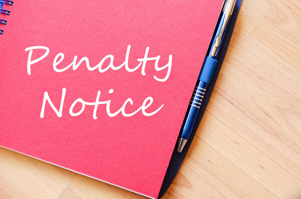 Penalty notice write on notebook