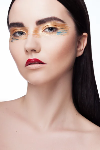 Woman with golden make up Stock Picture