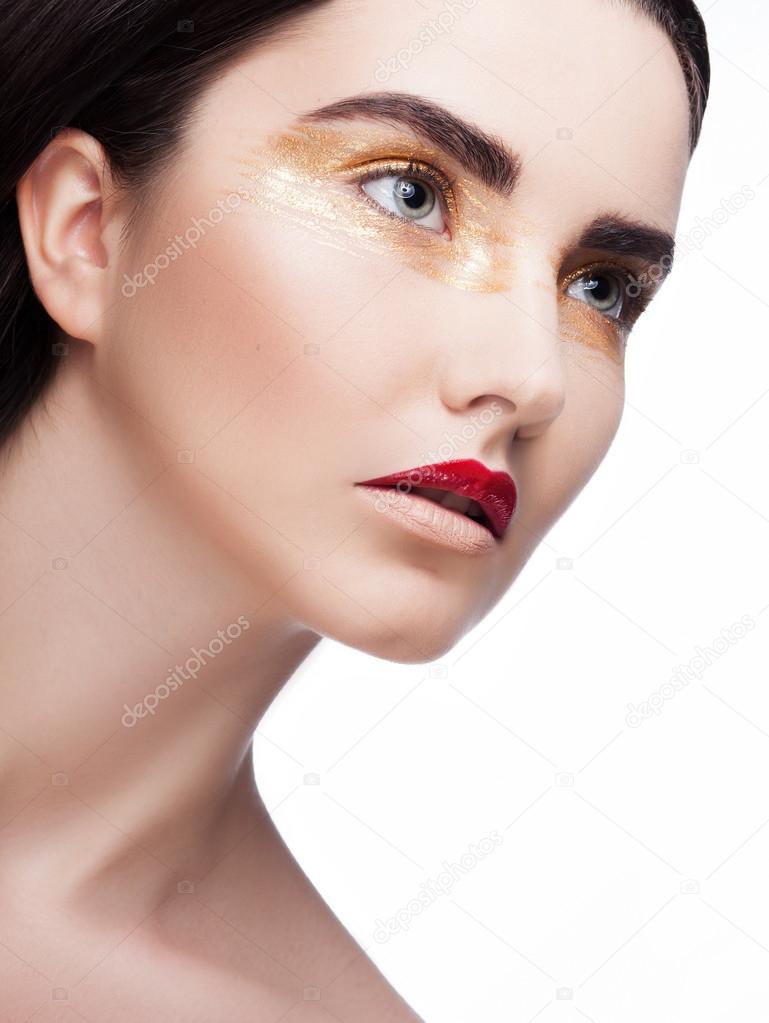 Woman with golden make up
