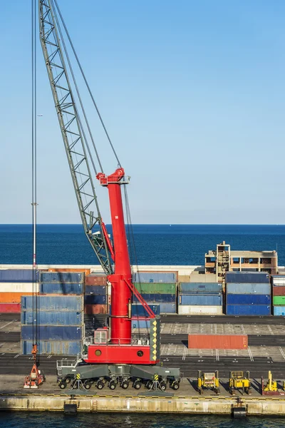 Huge port crane surrounded by containers — Stock Photo, Image