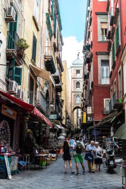 Naples, Italy - September 9, 2019: Spaccanapoli, narrow shopping street with people around in the old town of Naples, Italy