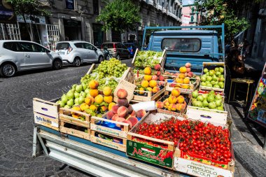 Naples, Italy - September 6, 2019: Van converted into a fruit and vegetable store on a street in the old town of Naples, Italy