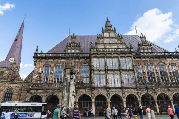 Bremen, Germany - August 19, 2019: Facade of the Bremen City Hall with people around in the old town of Bremen, Germany