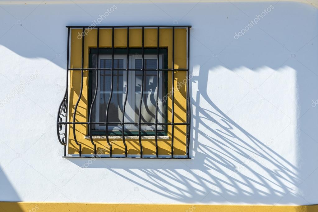barred window in Evora, Portugal