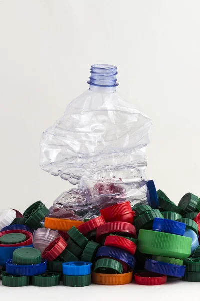 Plastic plugs and bottle — Stock Photo, Image