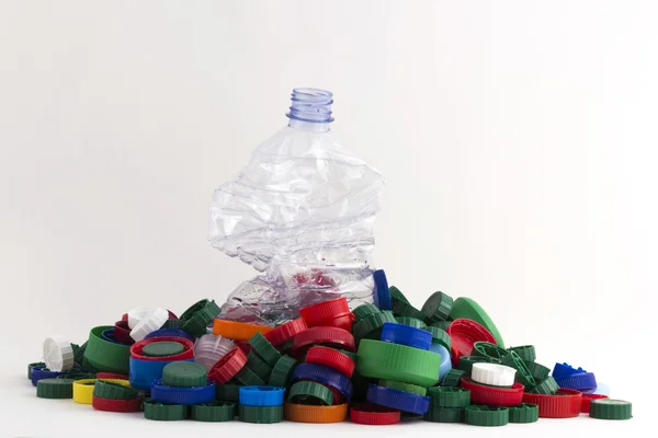 Plastic plugs and bottle — Stock Photo, Image