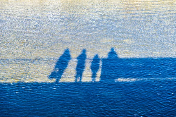 Family reflected in a river — Stock Photo, Image