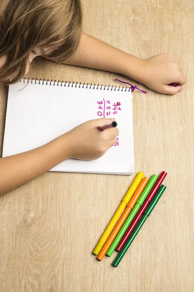 Little girl doing homework — Stock Photo, Image