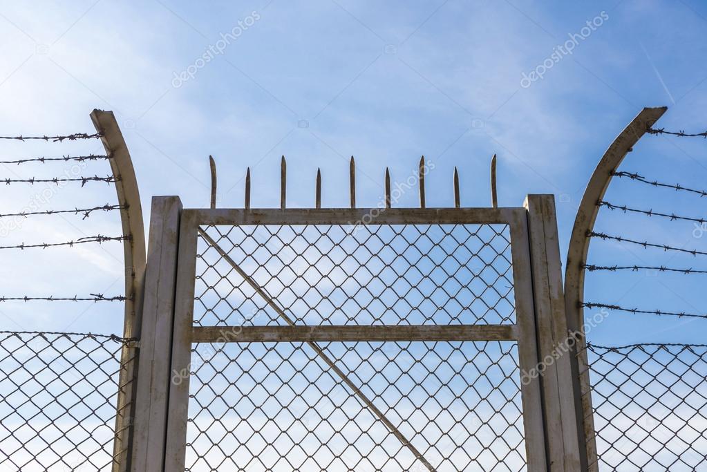 Barbed wire against the sky