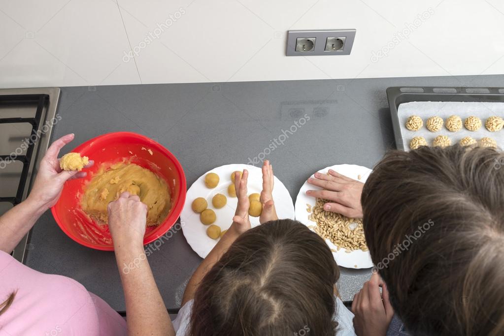 Family preparing sweets in the kitchen