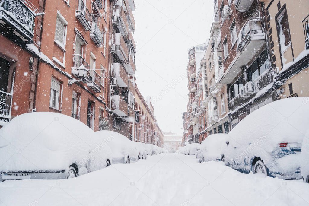 Historic snowfall in Madrid, capital of Spain in January 2021. Saturday, 9 January in district Arganzuela, Imperial, Calle Mazarredo