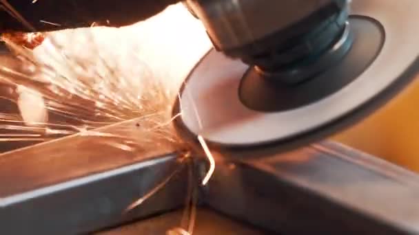 Saws metal with a circular saw, many sparks. The working process. Macro view — Stock Video
