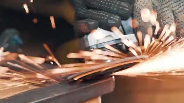 Saws metal with a circular saw, many sparks. The working process. Macro view — Stock Video