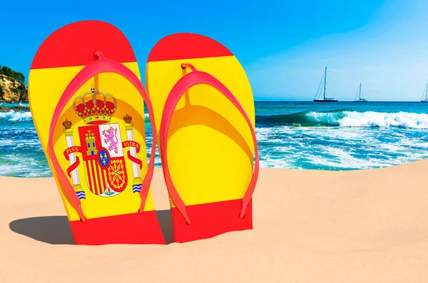 Flip flops with Spanish flag on the beach. Spain resorts, vacation, tours, travel packages concept. 3D rendering