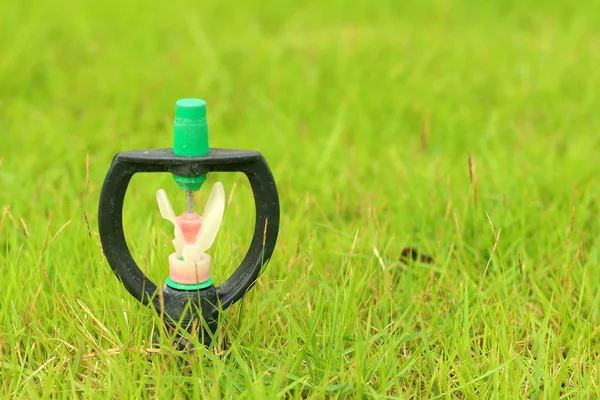 Sprinkler is stuck in in the grass. — Stock Photo, Image