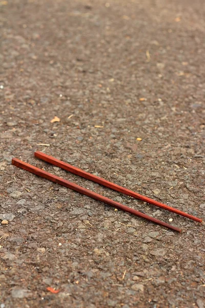 A pair of chopsticks on a black background. — Stock Photo, Image