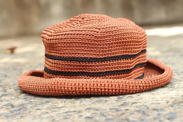 Brown hat on a background of cement. — Stock Photo, Image