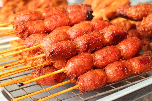 BBQ sausages on the grill in the market — Stock Photo, Image