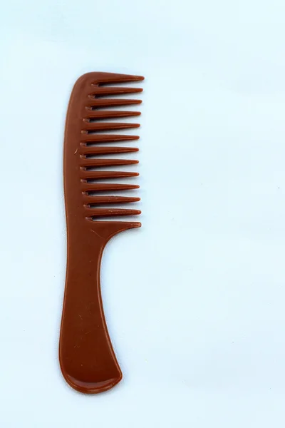 A wooden comb on a white background — Stock Photo, Image