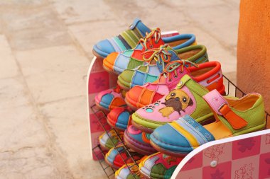 handmade of shoes put on the shelves clipart