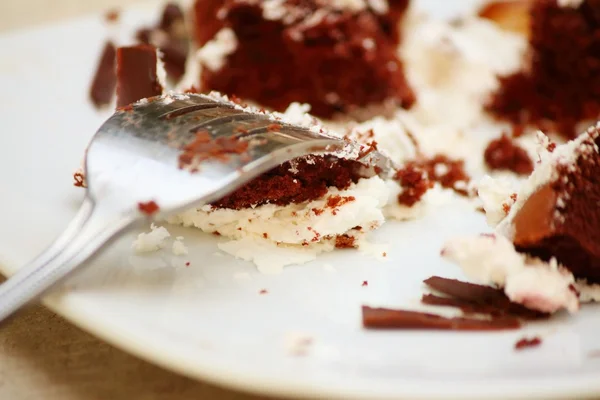 Chocolate cake on a white plate with a fork. — Stock Photo, Image