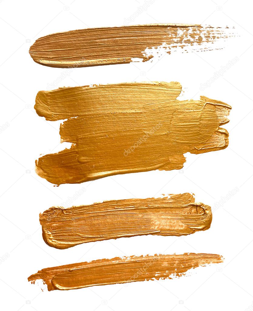 Beautiful textured golden strokes on a white background. Gold hot foil, gold leaf. Collection of brush strokes of gold paint.