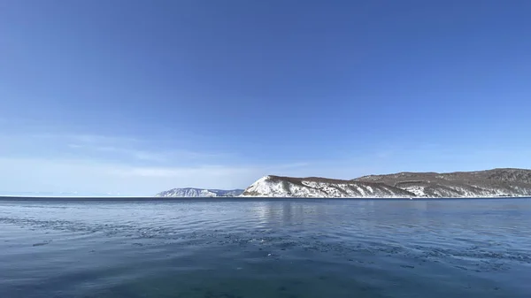 The non-freezing Angara river near Lake Baikal. Northern landscape of frozen Lake Baikal. Irkutsk, Olkhon Island, natural landmark of Russia.