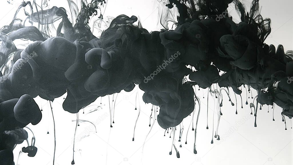 Black watercolor paints in water on a white background. Environmental pollution concept. Desktop wallpaper. Black cloud of ink on a white background. Creative hyptonic background.
