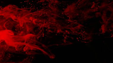 Müthiş soyut bir arka plan. Suya kırmızı mürekkep damlaları. Kozmik yıldız arkaplanı. Kırmızı suluboya siyah arka planda suyla boyanır. Masaüstünüz için güzel bir duvar kağıdı. Kırmızı mürekkep bulutu.