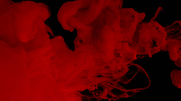 Beautiful wallpaper for your desktop. Red cloud of ink. Awesome abstract background. Drops of red ink in water. Cosmic star background. Blood red watercolor paints in water on a black background.