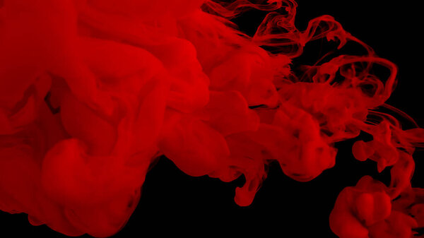 Red cloud of ink. Awesome abstract background. Drops of red ink in water. Cosmic star background. Blood red watercolor paints in water on a black background. Beautiful wallpaper for your desktop.