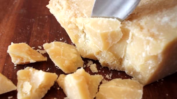 Cutting pieces of parmesan — Stock Video