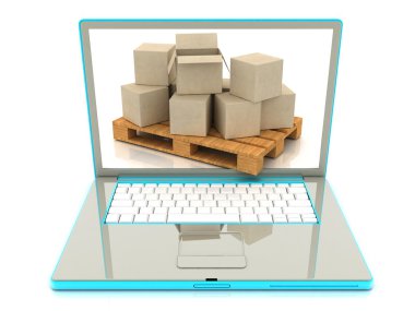 Karton kutular bir dizüstü bilgisayarda. e-ticaret kavramı.