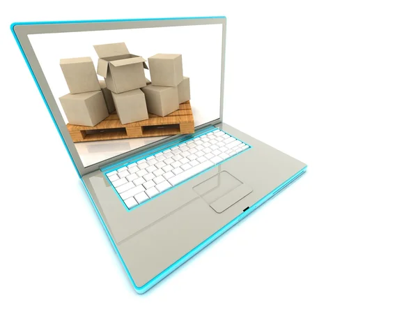 Karton kutular bir dizüstü bilgisayarda. e-ticaret kavramı.