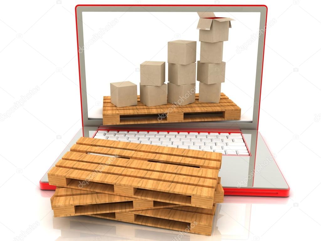 Cardboard boxes on a laptop. The concept of online orders for goods.