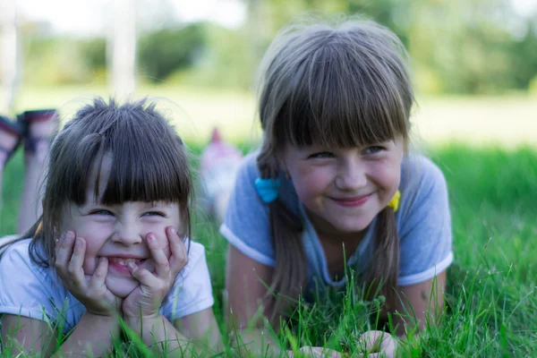 Children playing on the grass — Stock Photo, Image