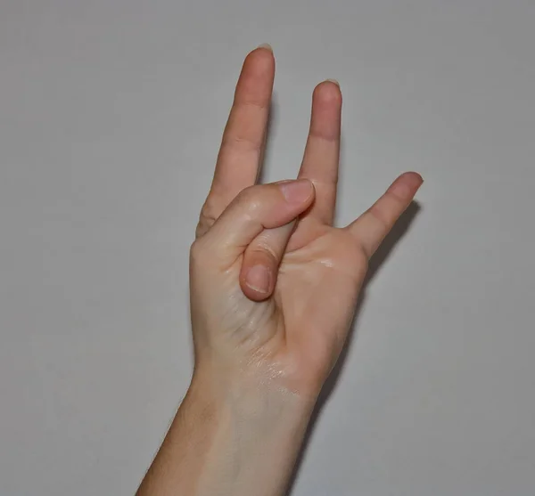 A certain position of the fingers for health (mudra).