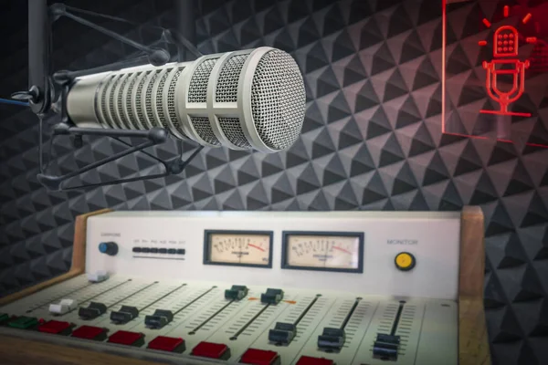 radio station studio: professional microphone and sound console