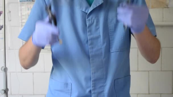 Doctor puts a stethoscope gloves — Stock Video