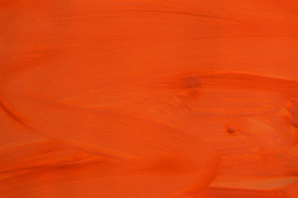 Pociągnięcia pędzlem pomarańczowy farby na powierzchni — Zdjęcie stockowe