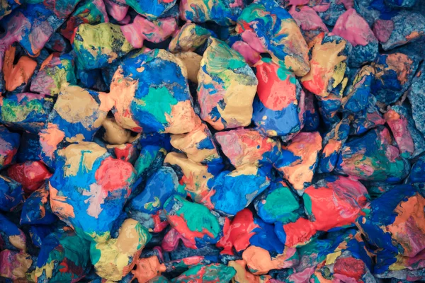Pebbles painted bright colored paint — Stock Photo, Image