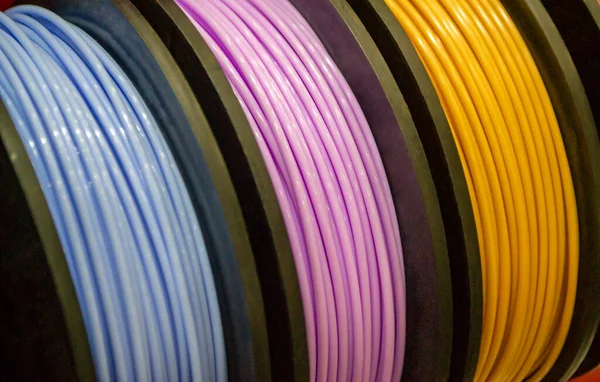 Multicolored filaments of plastic for printing on 3D printer close-up