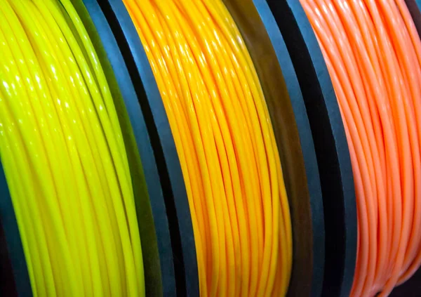 Multicolored filaments of plastic for printing on 3D printer close-up