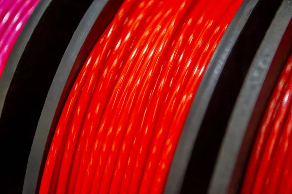 Multicolored filaments of plastic for printing on 3D printer close-up