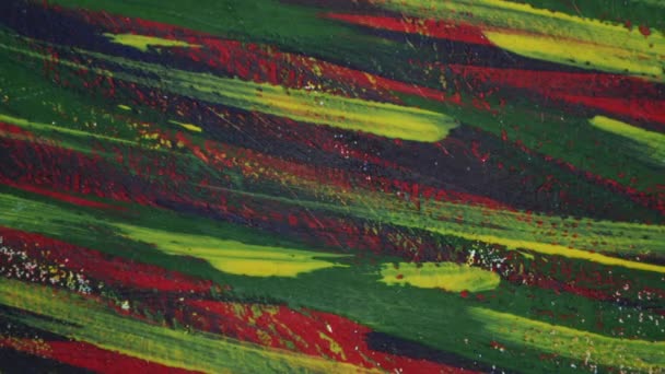 Background from different strokes of red, yellow, green and blue paint — Stock Video