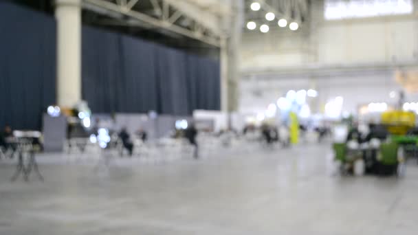 Blurred background. People walk inside large space building. — Stock Video