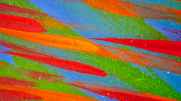 Many different colored lines painted bright paint on canvas close-up. — Stock Video